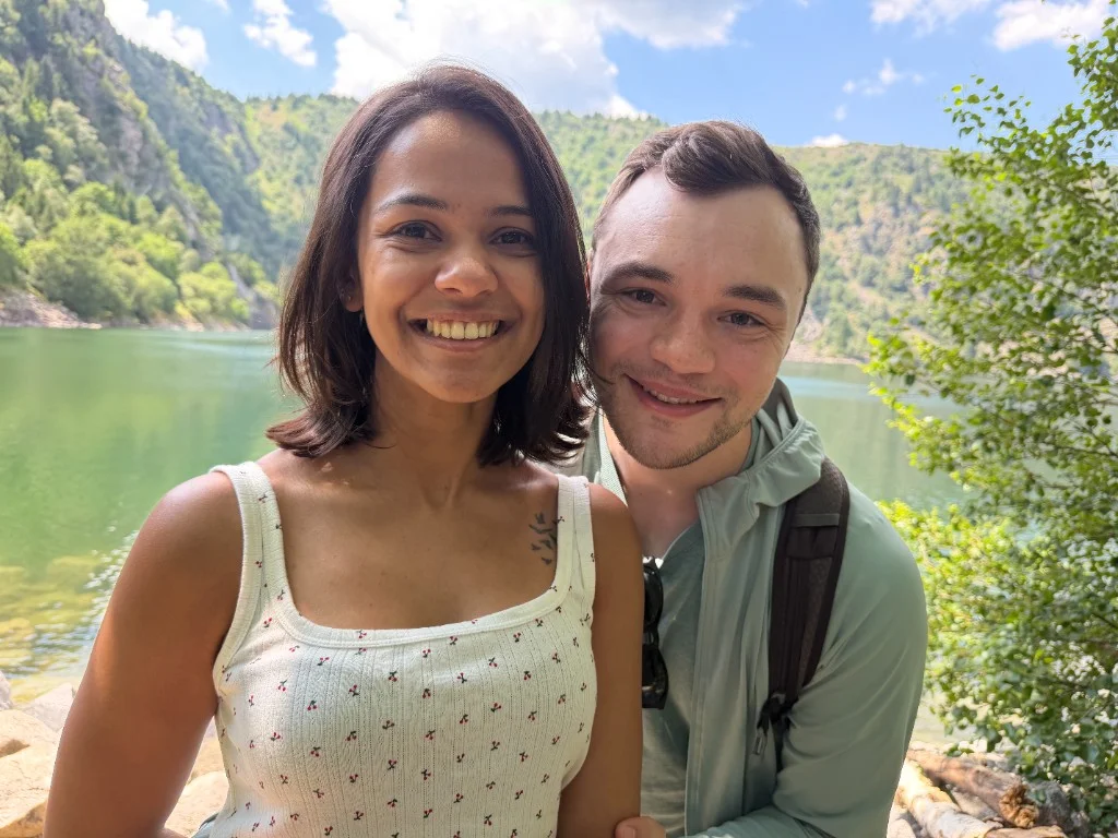Karthika and Kyle at a mountain lake