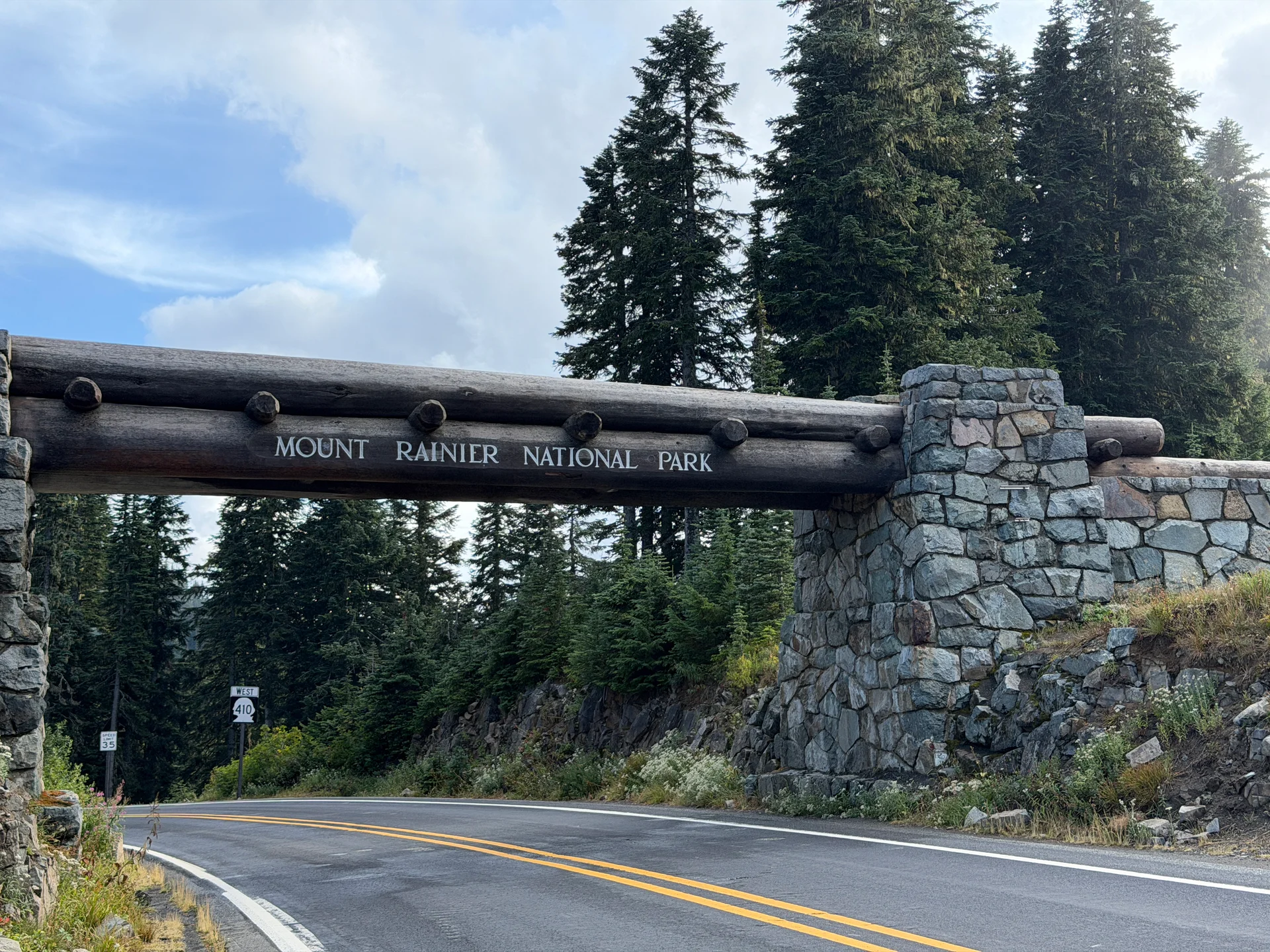 The log-and-stone Mount Rainier National Park arch over WA-410 at Chinook Pass